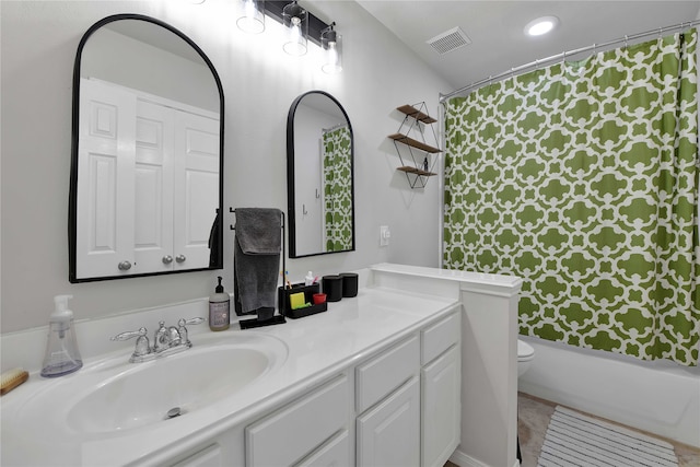 full bathroom with tile patterned floors, vanity, shower / bathtub combination with curtain, and toilet