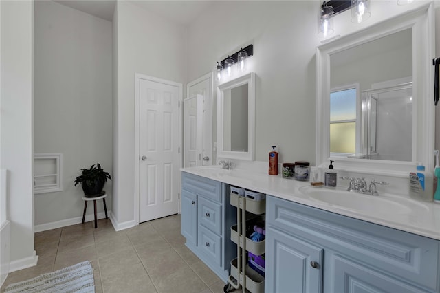 bathroom with vanity and tile patterned flooring