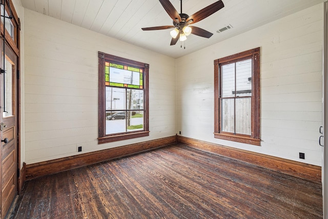 1214 Crockett St, Houston, TX 77007 - empty room featuring dark wood-style flooring, baseboards, and a ceiling fan
