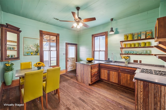 kitchen featuring pendant lighting, dark hardwood / wood-style flooring, sink, and ceiling fan