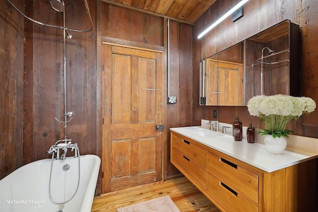 1214 Crockett St, Houston, TX 77007 - full bathroom featuring a freestanding tub, vanity, a shower, wood finished floors, and wood walls
