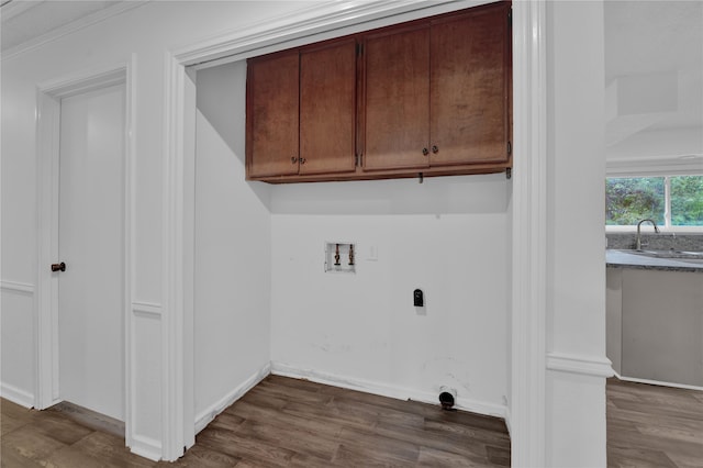 laundry room with cabinets, washer hookup, sink, and dark hardwood / wood-style floors