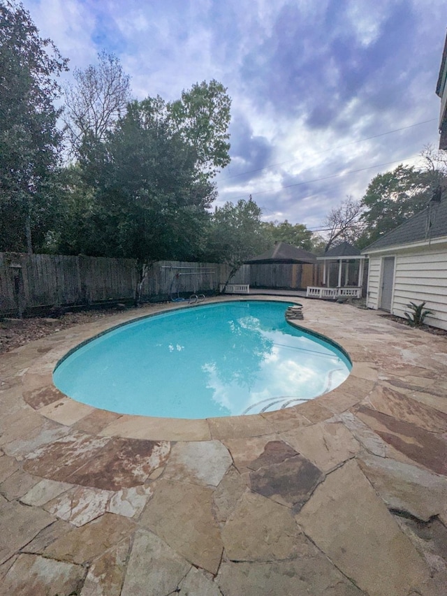 view of swimming pool featuring a patio