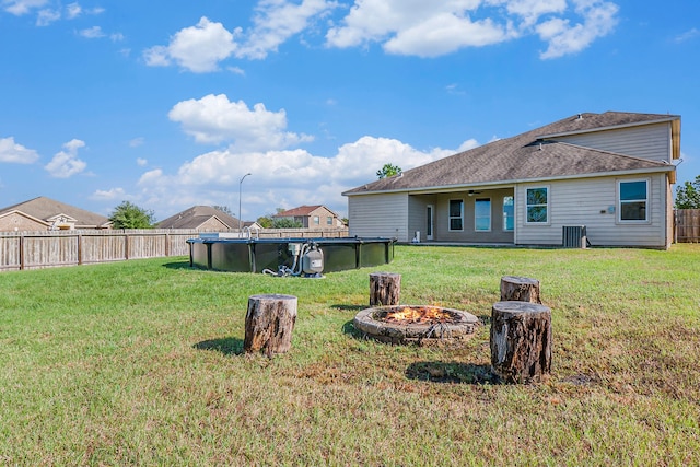 view of yard with an outdoor fire pit