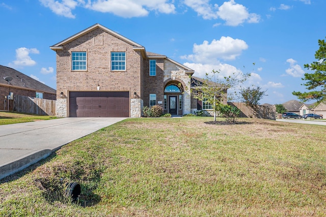 view of front property featuring a front lawn and a garage