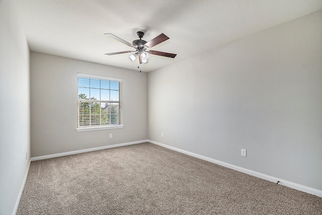 empty room with carpet floors and ceiling fan