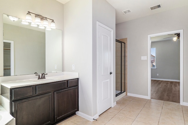 bathroom featuring vanity, tile patterned flooring, a shower with door, and ceiling fan