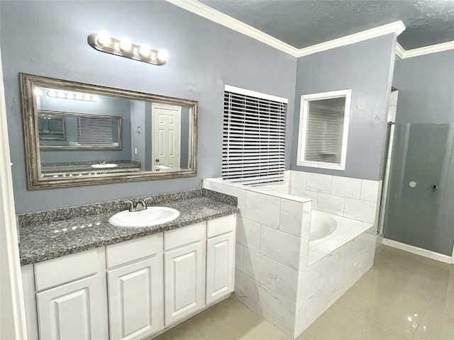 bathroom featuring vanity, tiled bath, tile patterned floors, and crown molding