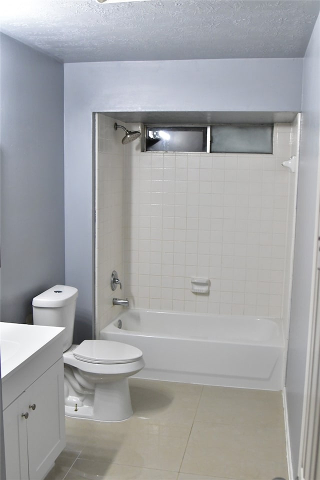 full bathroom with vanity, tile patterned floors, a textured ceiling, and toilet