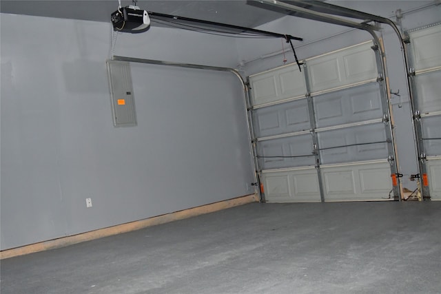 garage featuring a garage door opener and electric panel