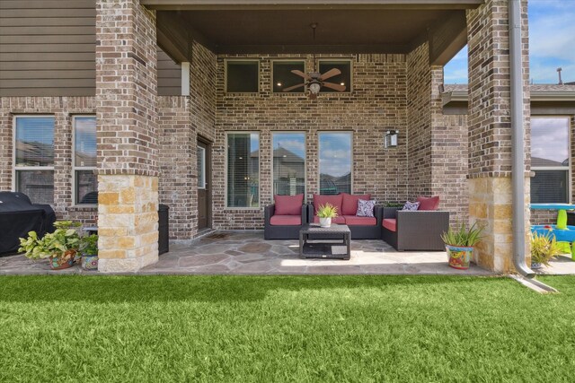 view of patio with a grill, ceiling fan, and an outdoor living space