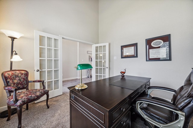 office with light carpet, french doors, and a high ceiling