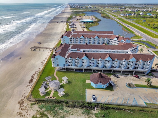 bird's eye view with a beach view and a water view