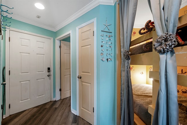 hall with dark hardwood / wood-style flooring and ornamental molding