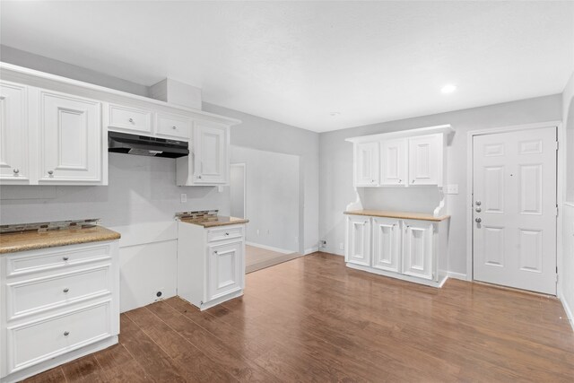 kitchen with white cabinets and dark hardwood / wood-style flooring