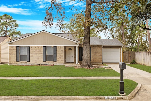 ranch-style house featuring a garage and a front yard