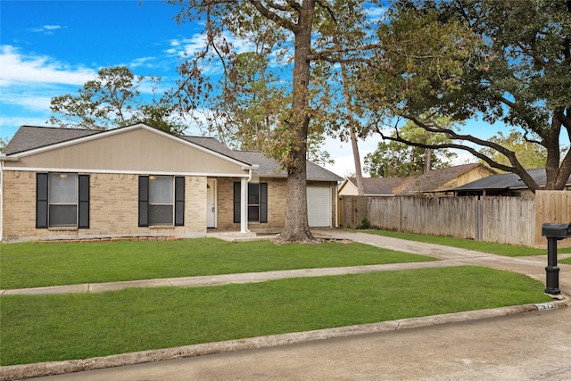 single story home with a garage and a front yard