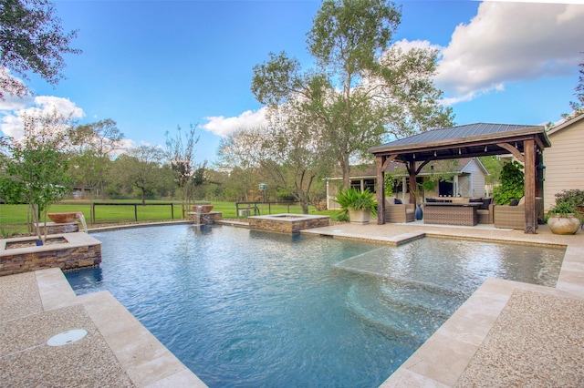 view of swimming pool with a gazebo, an in ground hot tub, and an outdoor hangout area