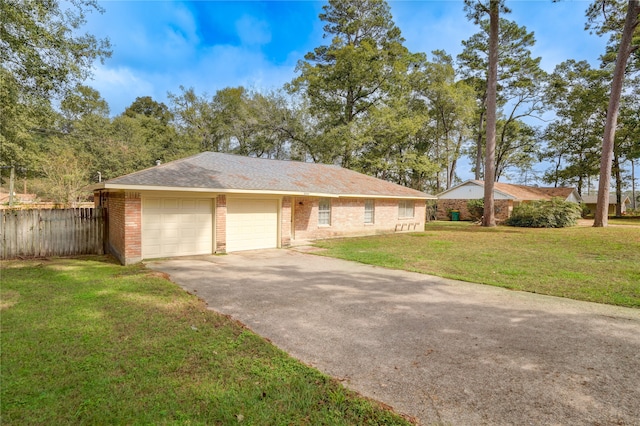 ranch-style house with a garage and a front yard