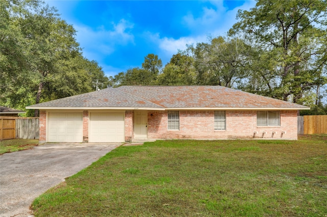 single story home with a front lawn and a garage