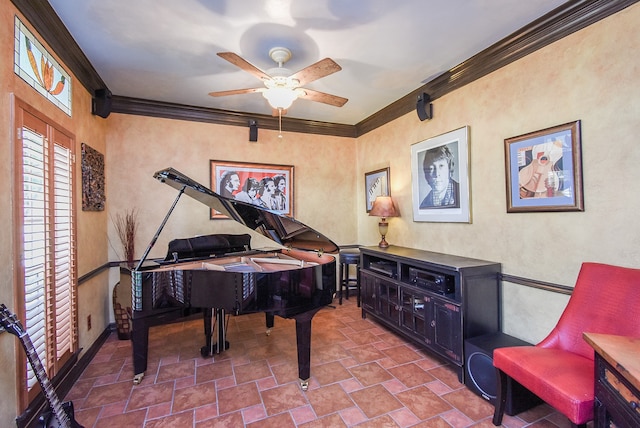 miscellaneous room with ceiling fan and crown molding