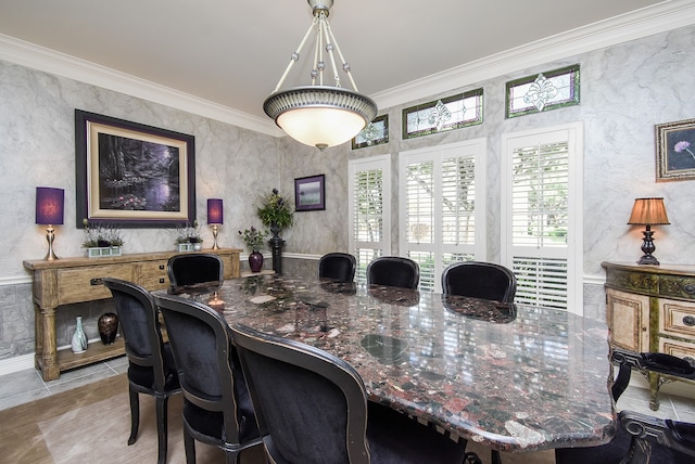 dining space featuring crown molding