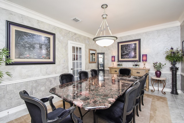 tiled dining area with crown molding