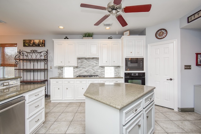 kitchen featuring white cabinets, black appliances, and a kitchen island