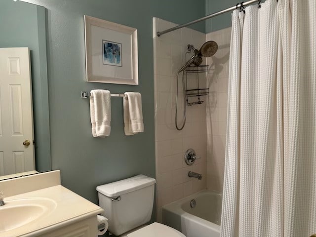 full bathroom featuring vanity, toilet, and shower / tub combo