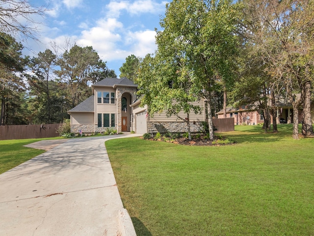 view of front facade featuring a front yard and a garage