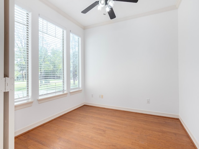 spare room with ornamental molding, light hardwood / wood-style flooring, and ceiling fan