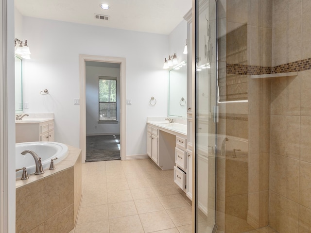 bathroom featuring tile patterned flooring, vanity, and independent shower and bath