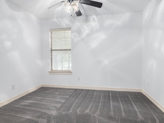 spare room featuring carpet flooring and ceiling fan