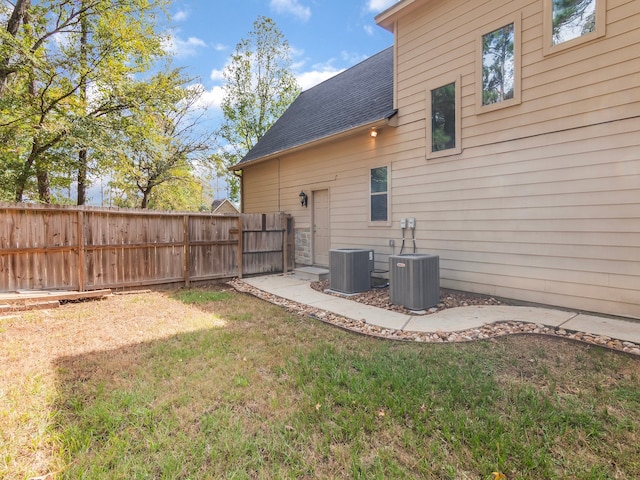 view of yard with central AC unit