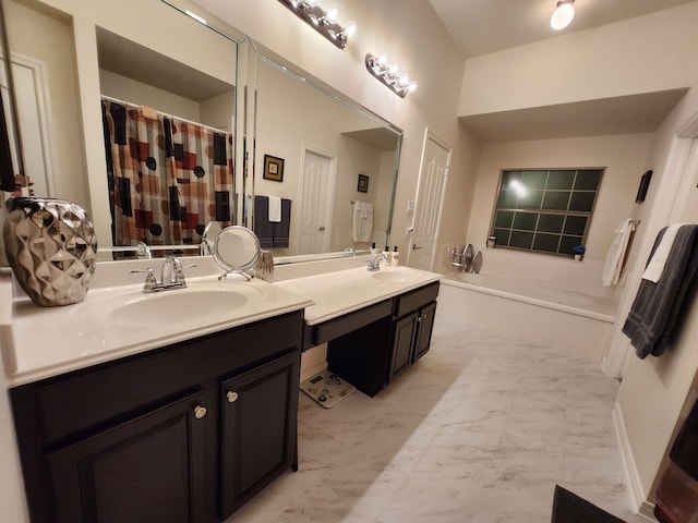 bathroom featuring a tub and vanity