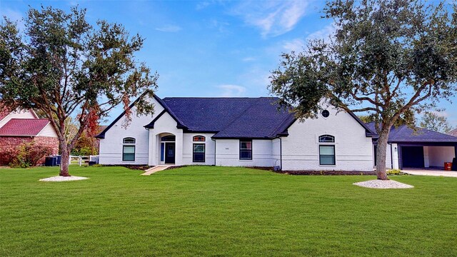 french country home featuring a front yard