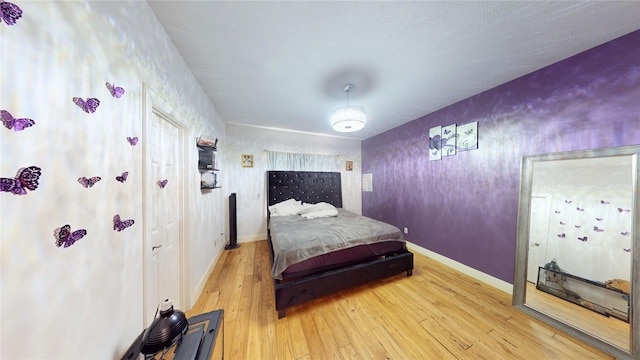 bedroom with wood-type flooring