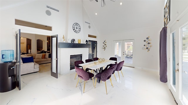 dining room featuring french doors and high vaulted ceiling