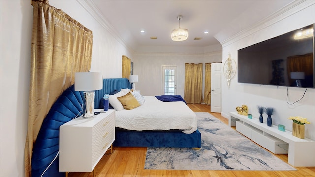 bedroom with recessed lighting, wood finished floors, and ornamental molding