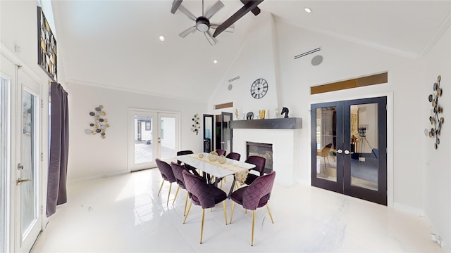 dining area with ceiling fan, french doors, and high vaulted ceiling