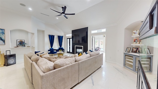 living room featuring ceiling fan, a large fireplace, lofted ceiling, and ornamental molding