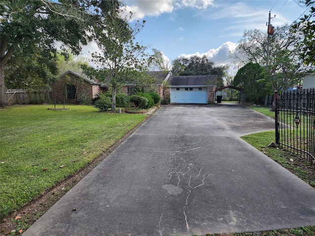 single story home featuring a garage and a front yard