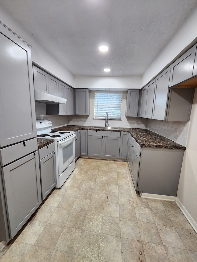 kitchen featuring sink, white electric range oven, and gray cabinetry