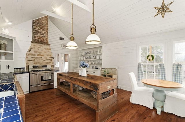 kitchen with dark wood finished floors, tile countertops, gas stove, and lofted ceiling with beams