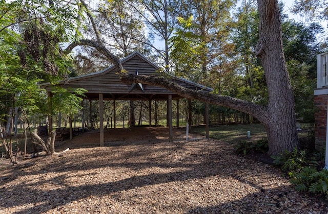 view of property's community featuring a carport and driveway