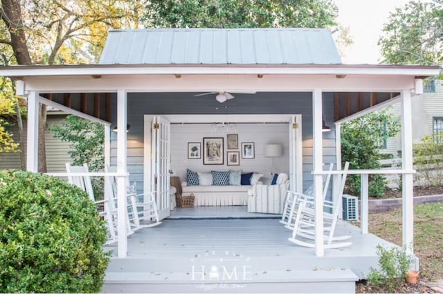 property entrance with a standing seam roof, a porch, and metal roof