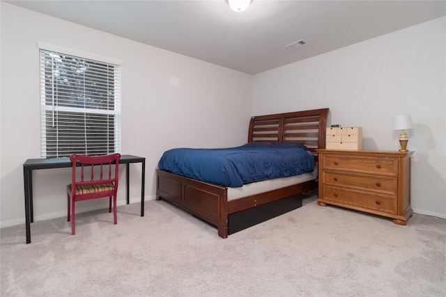 bedroom featuring light carpet