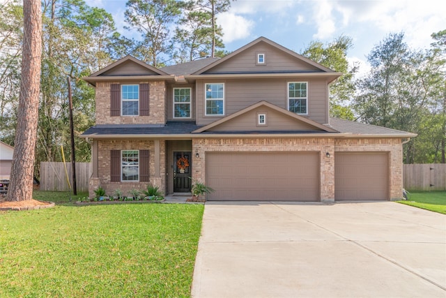 view of front of home featuring a garage and a front yard