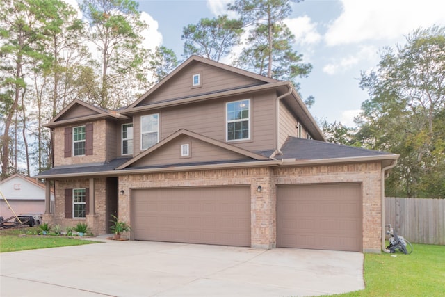 view of front of home featuring a garage and a front yard