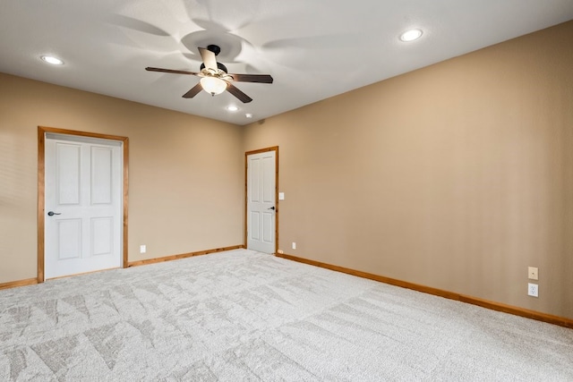 unfurnished room with light carpet, recessed lighting, a ceiling fan, and baseboards